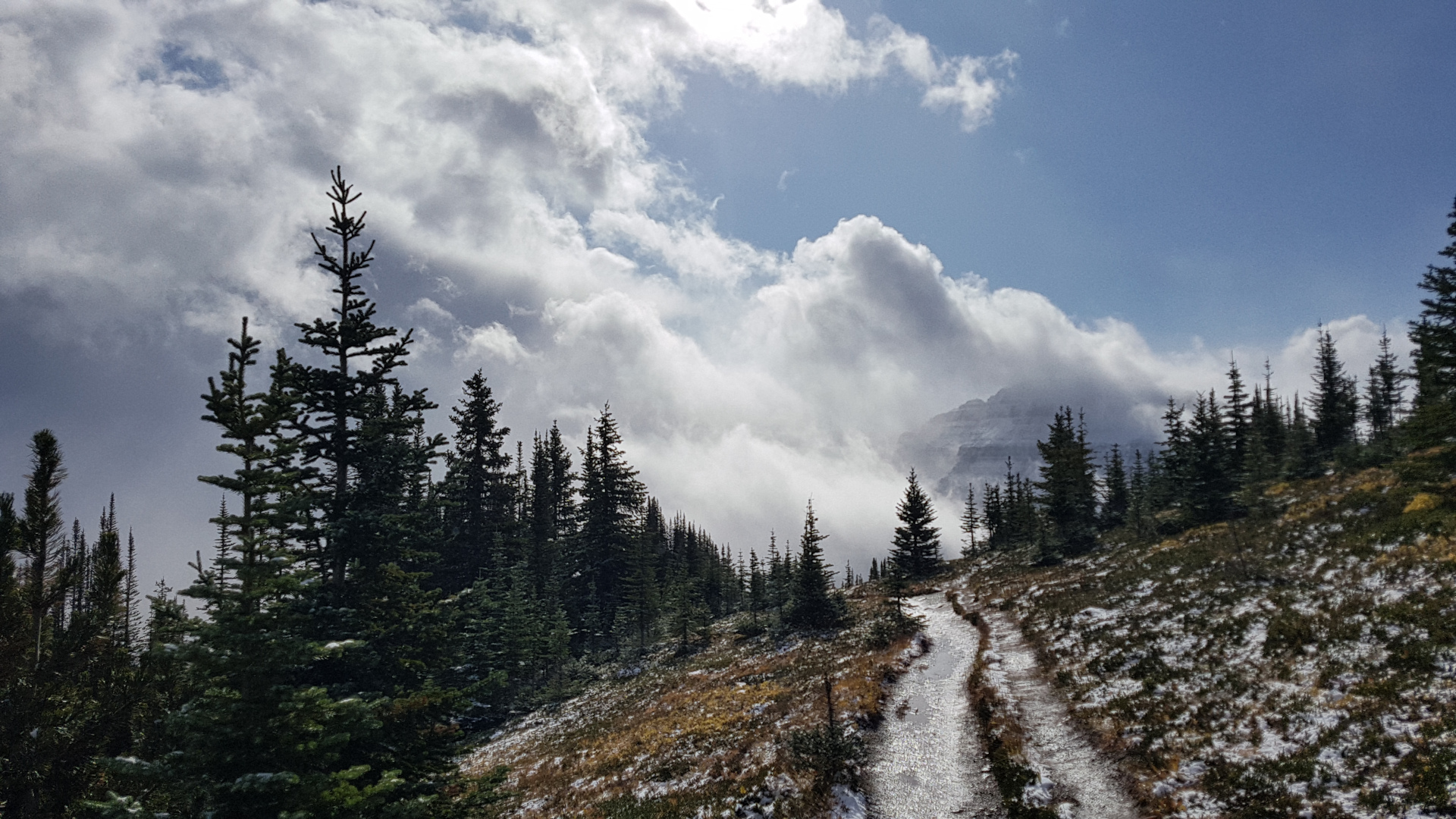 Clouds moving temporarily on Dolomite Pass hiking trail. Weather was changing rapidly throughout the day.
